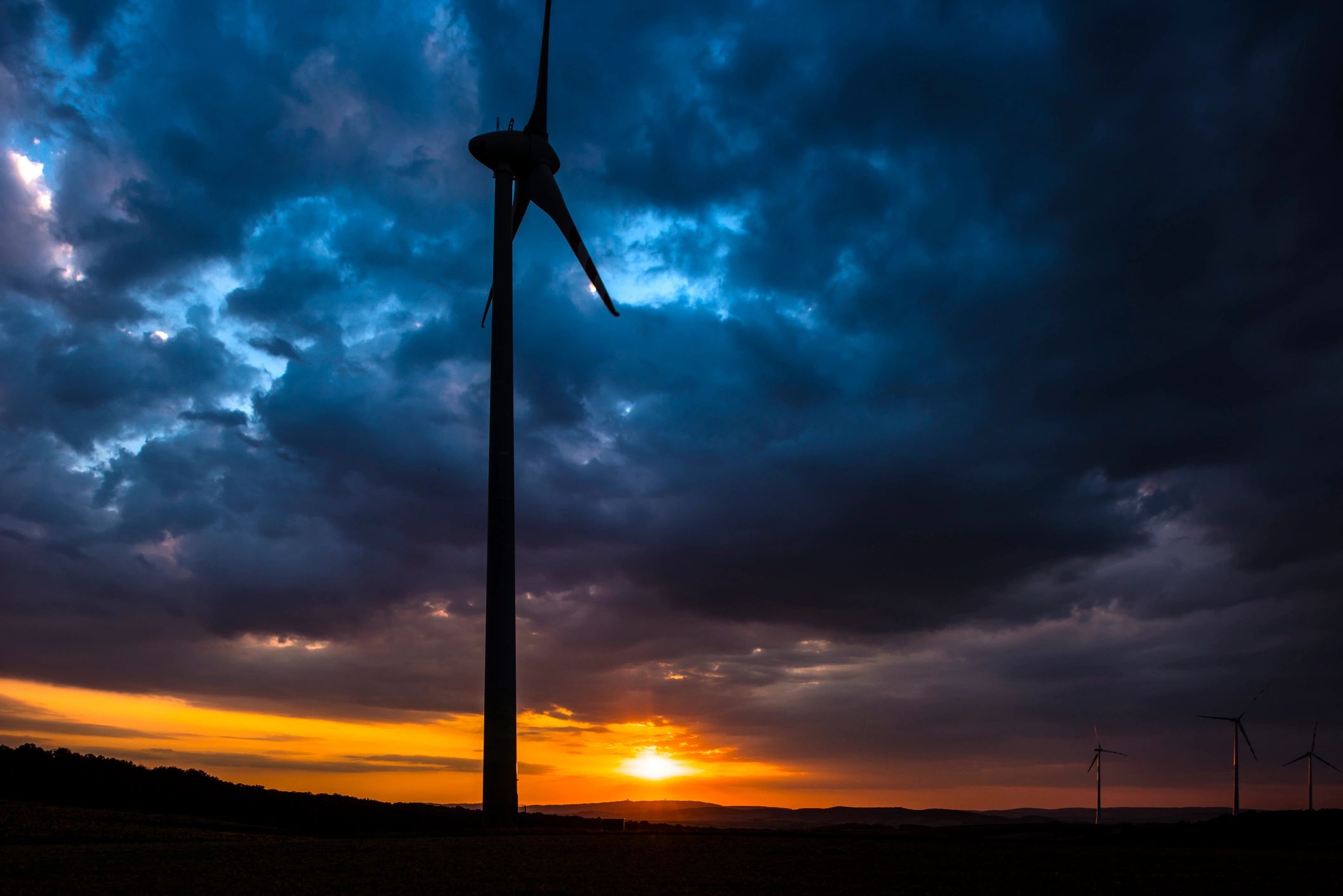 Wind energy infrastructure at sunset