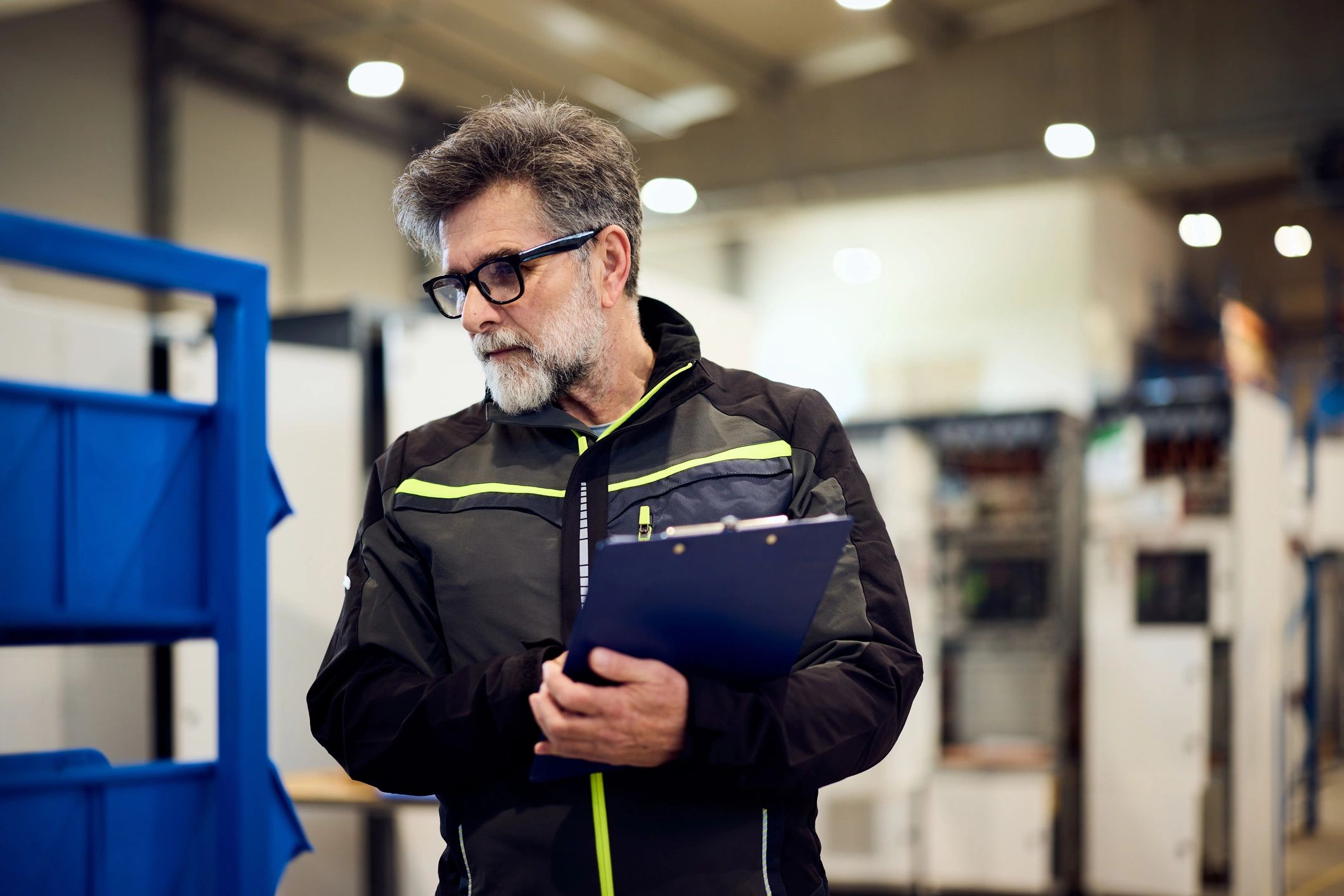 Factory worker performing quality inspection in an industrial environment