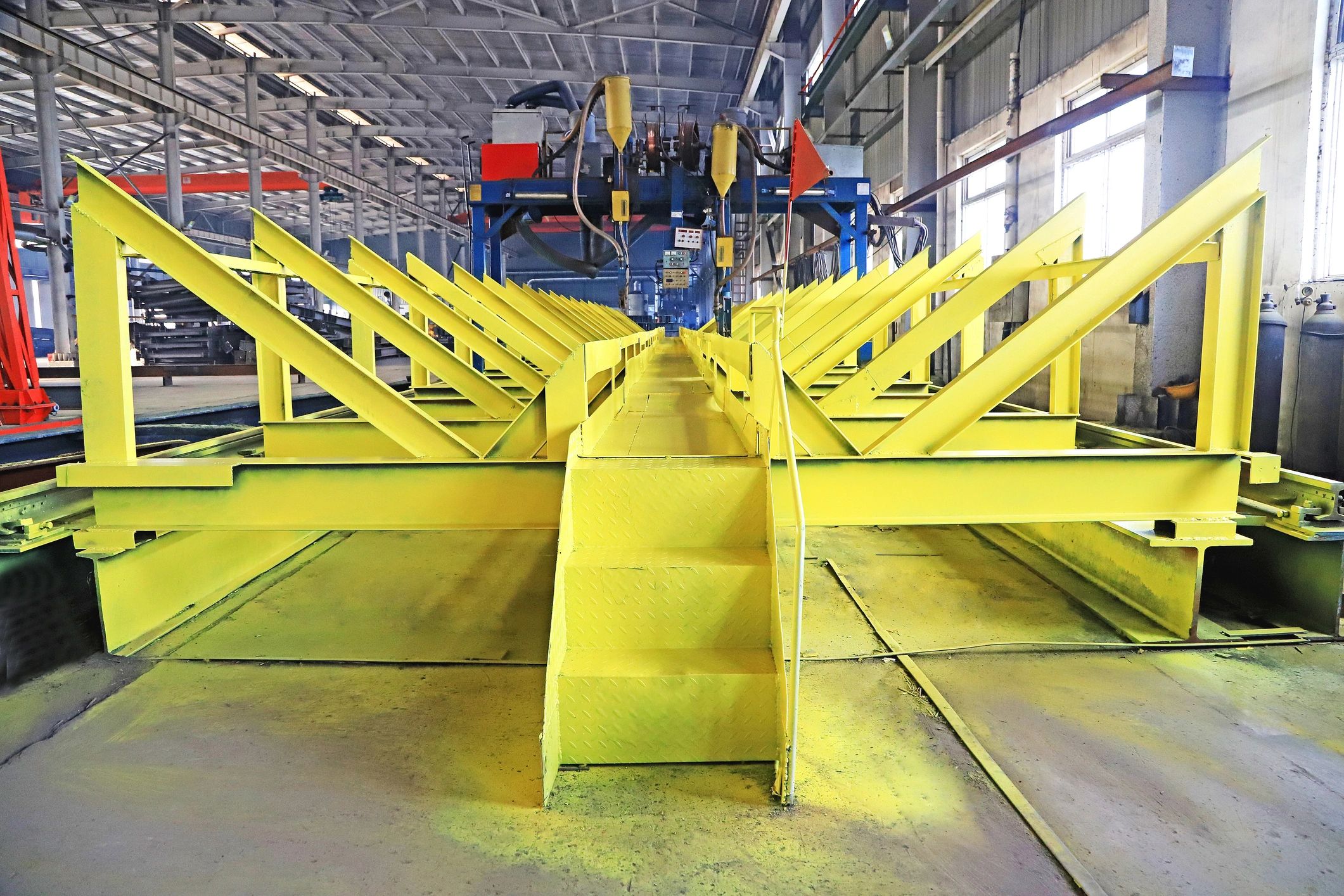 Fabricated structural steel frames in an industrial workshop