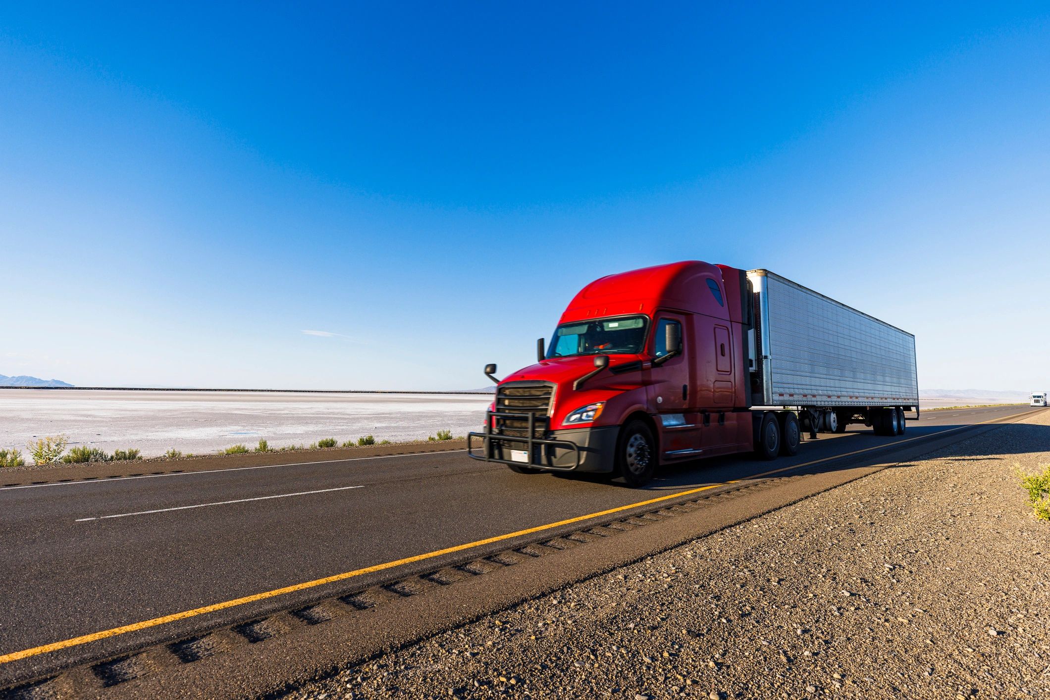 Heavy-duty truck hauling cargo on highway