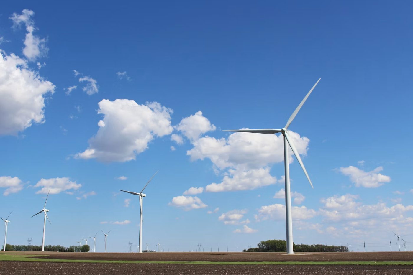 Utility-scale wind turbines across open farmland